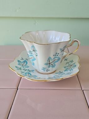 Vintage-Inspired Blue Floral Porcelain Teacup and Saucer with Gold Trim #1